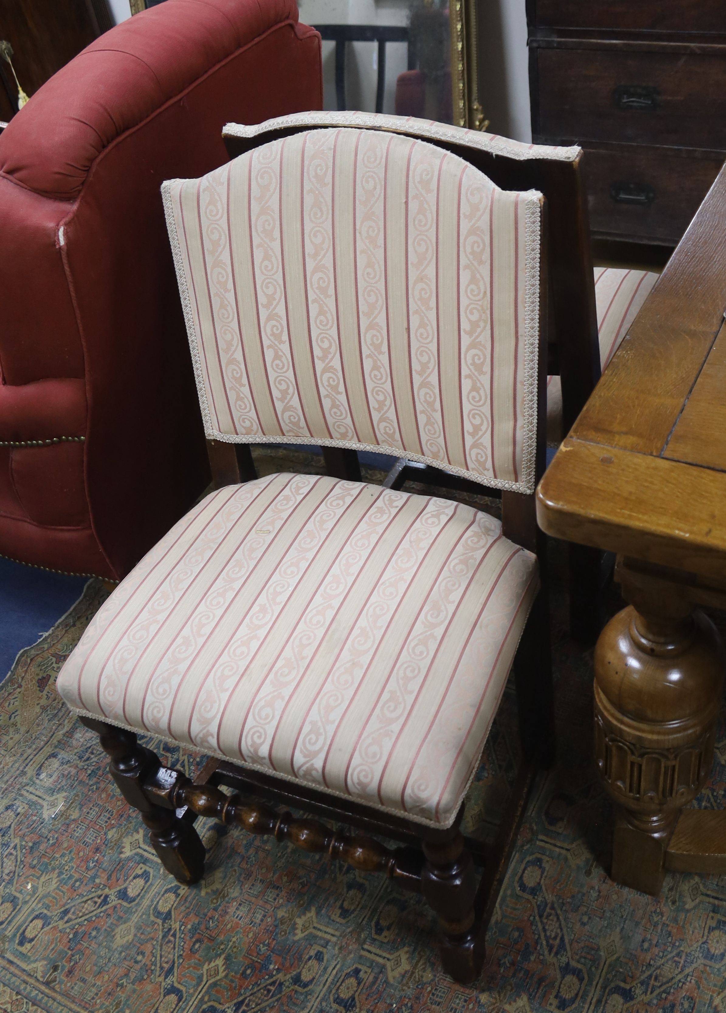 A set of eight 18th century style upholstered oak dining chairs, two with arms